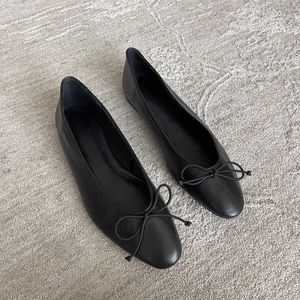 Black ballet flats with bow